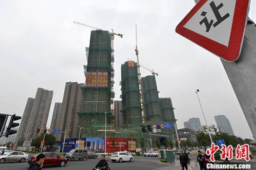 資料圖：福州一處商品房在建中。 <a target='_blank' href='http://www.chinanews.com/'>中新社</a>記者 呂明 攝